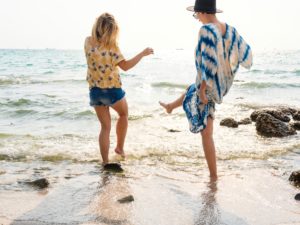 Remission by ketamine treatment allows these girls to play in the surf.