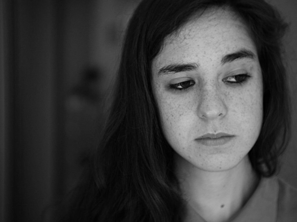Sad woman with suicidal thoughts because of suffering of bipolar disorder.