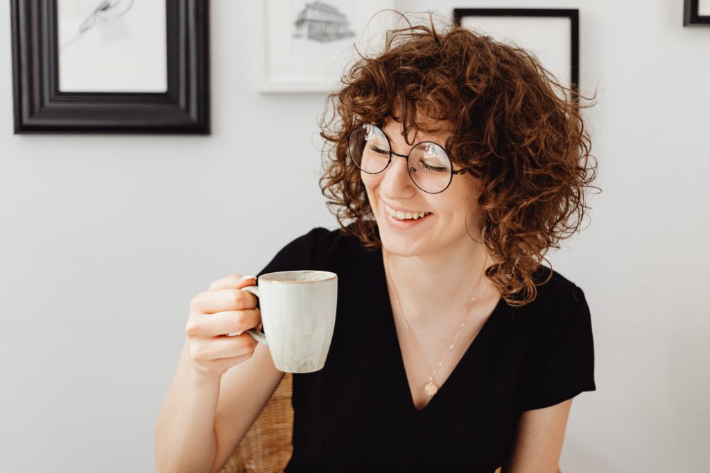 Lady enjoying flavonoids in her green tea.